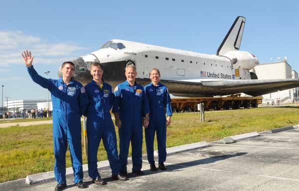 Atlantis crew during orbiter rollover from OPF to VAB, May 17, 2011.